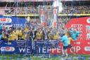 Oxford United lift the trophy during celebrations