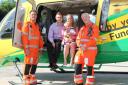 WAA Critical Care Paramedics Richard Miller (left) and Steve Riddle (right) with Craig, Lucas and Gemma Duff