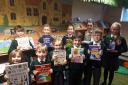 St Joseph's School pupils show off their new books
