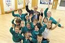 Paul Overton, head teacher at St Peter's Primary School in Pilning with his school council pupils celebrating the school's Ofsted repor