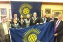 Dame Janet with local mayors and the Commonwealth Flag