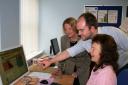 Nick Lee, Cllr Carole Topple and a CAB volunteer test out the new email system