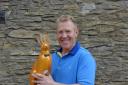 BBC Countryfile's Adam Henson has decorated a mini hare for the new trail