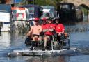 Alex Gibson (left), a GB decathlete who was diagnosed with Motor Neurone Disease four years ago, leads his team of Challenging MND fellow hydro-pedallers (second left to right) Andy Long, Joe Reed, and Alun Thomas, as they travel along the River Thames