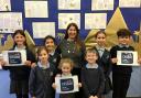 Staff and pupils celebrate as Eastcombe Primary School receives a good Ofsted report. 17467089