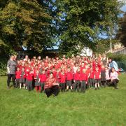 Pupils and staff from Uley Primary School celebrating the Ofsted result