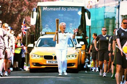 AS many as 20,000 spectators thronged the streets and cheered enthusiastically as the Olympic Torch wound its way through Stroud.
