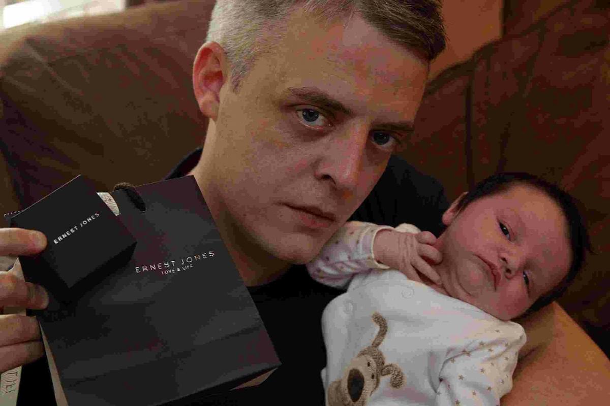 ANGER: <b>Colin Heath</b> with Ernest Jones jewellery and three-week old baby ... - 3458128