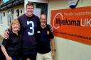 Nadine Thomas and her husband Rob with Ben Morgan (middle) unveiling a plaque for MyelomaUK at Dursley Rugby Club