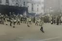 A parade outside the old Wicliffe Motors garage in Russell Street, Stroud