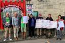 Dr Simon Opher with fellow campaigners trying to save the ticket office at Stroud railway station