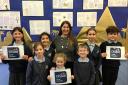 Staff and pupils celebrate as Eastcombe Primary School receives a good Ofsted report. 17467089
