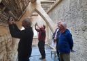 Volunteers inspecting repairs to the south side roof at Woodchester Mansion in March