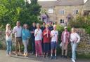 Chalford Hill Community Benefit Society committee members take a moment to celebrate with neighbours