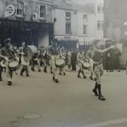 A parade outside the old Wicliffe Motors garage in Russell Street, Stroud