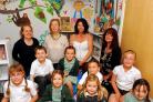 Children from Stroud Valley Community School in their new library with (back l-r) Anne-Marie Delrosa, PTFA treasurer, Susie Walker and Siobhan Adam, who painted the designs on the walls, and mayor Amanda Moriarty